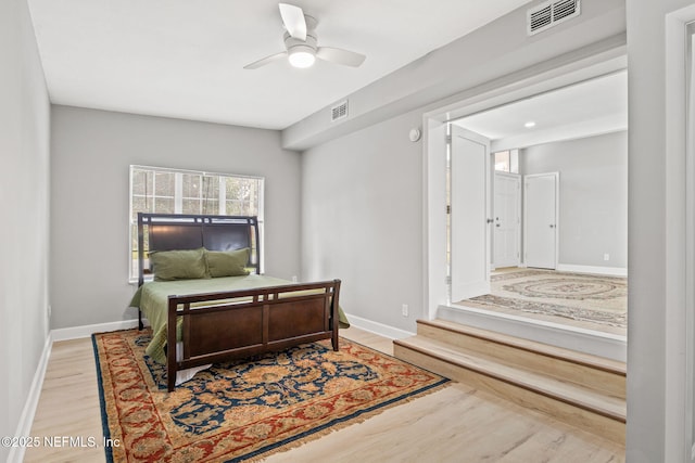 bedroom with ceiling fan and light wood-type flooring