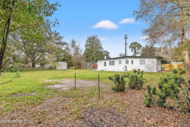 view of yard with a storage shed