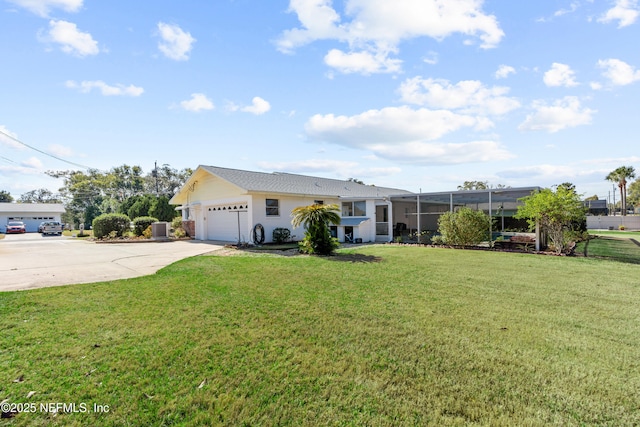 single story home featuring glass enclosure, cooling unit, a garage, and a front yard