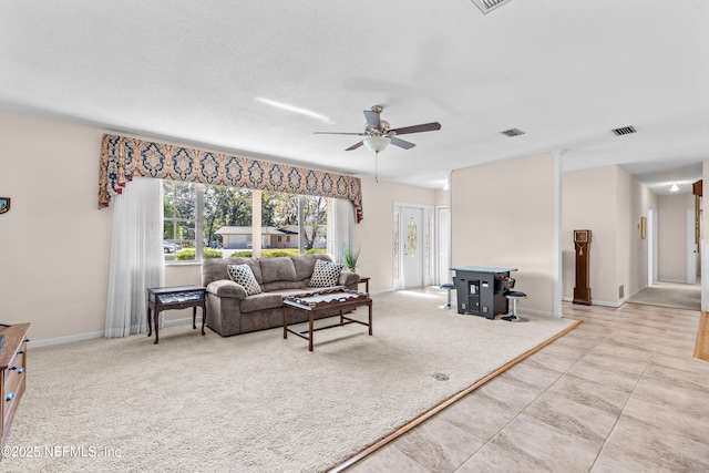 living room with light carpet and ceiling fan