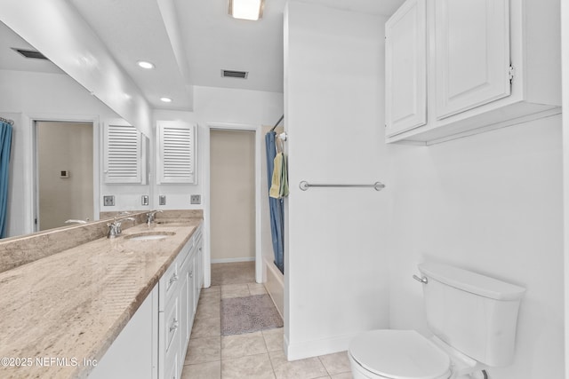 full bathroom with tile patterned floors, vanity, shower / bath combo, and toilet