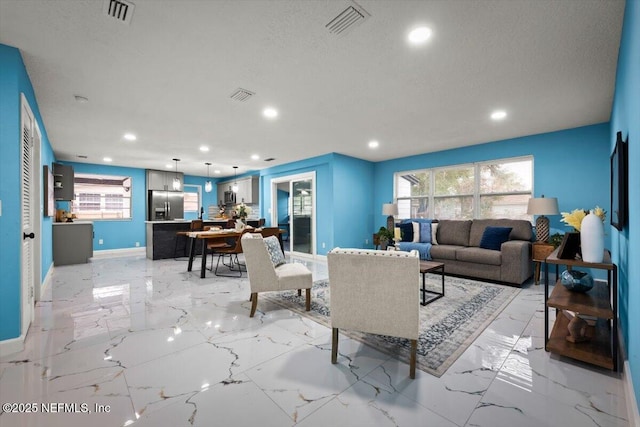 living room featuring a textured ceiling