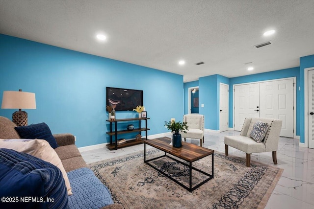 living room featuring a textured ceiling