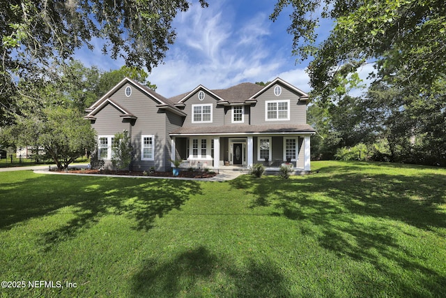 craftsman house featuring a front lawn and covered porch