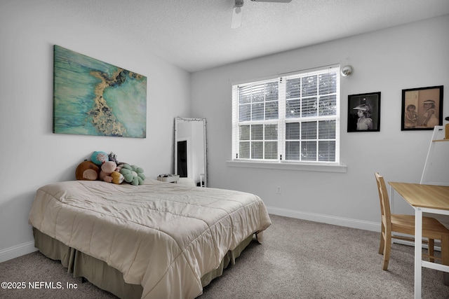 bedroom with carpet flooring, a textured ceiling, and ceiling fan