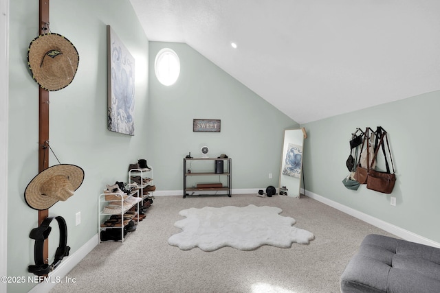 interior space featuring light carpet and lofted ceiling