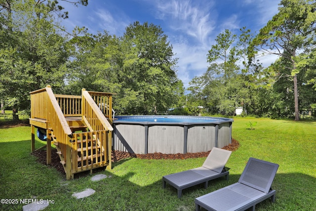 view of yard featuring a swimming pool side deck