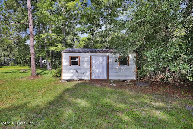 view of outdoor structure with a yard