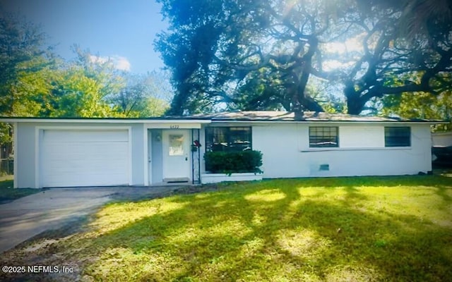 single story home with a garage and a front lawn