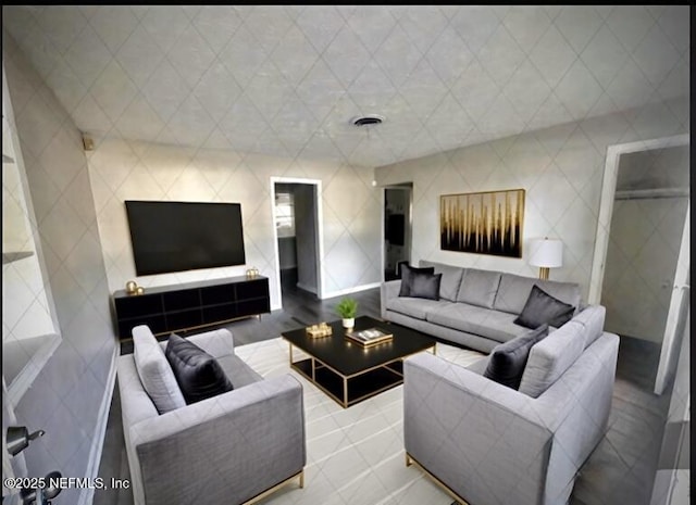 living room with tile walls