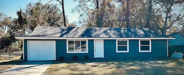 ranch-style house with a front yard and a garage