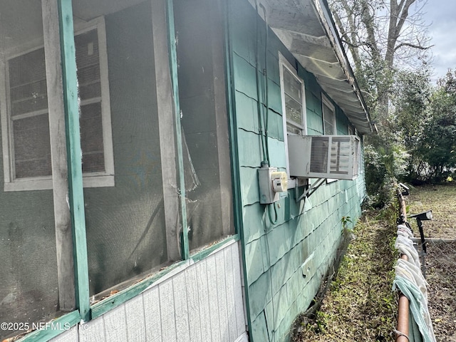 view of side of property with cooling unit