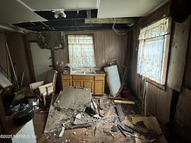 misc room featuring water heater and sink