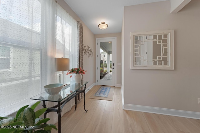 entryway with light hardwood / wood-style flooring