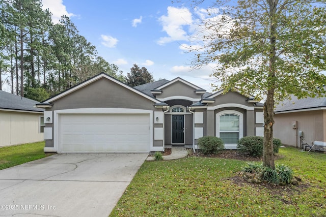 single story home with a garage and a front lawn