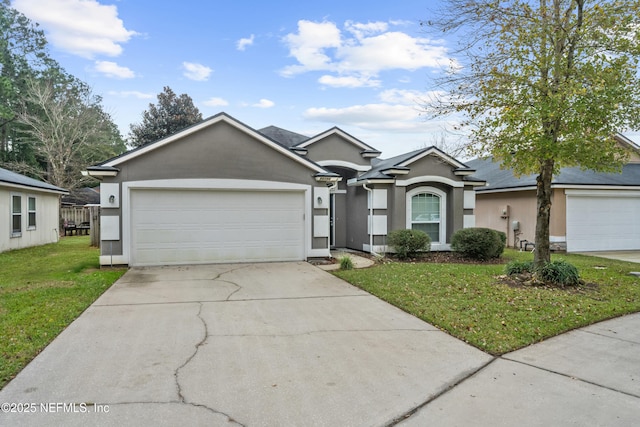 ranch-style home featuring a garage and a front lawn