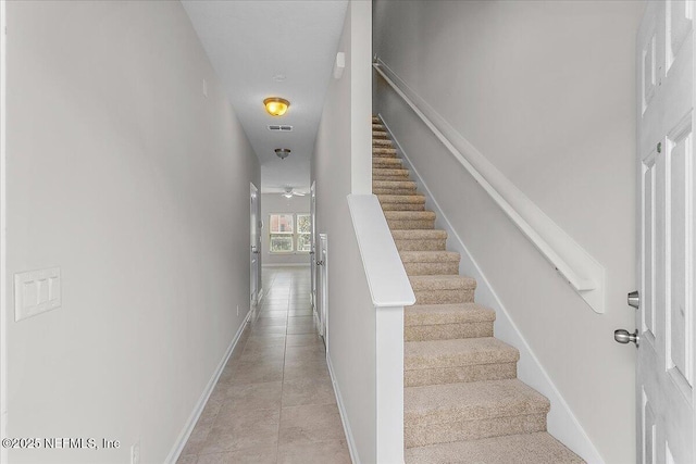 stairway with ceiling fan