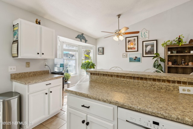 kitchen with dishwasher, light tile patterned floors, white cabinetry, and ceiling fan