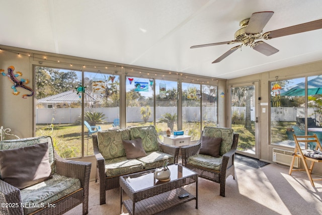 sunroom / solarium featuring ceiling fan