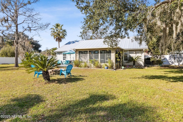 view of yard with a sunroom