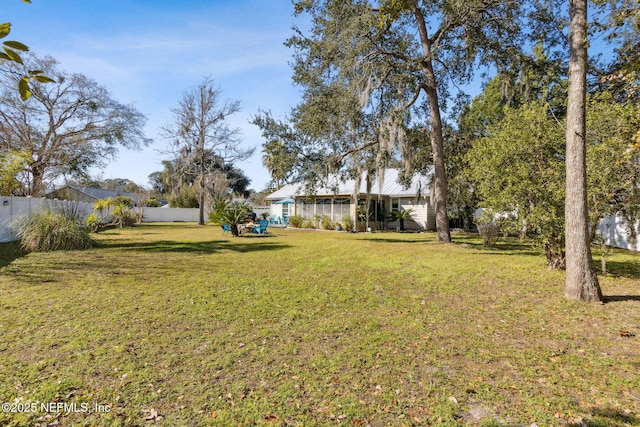 view of yard with a sunroom