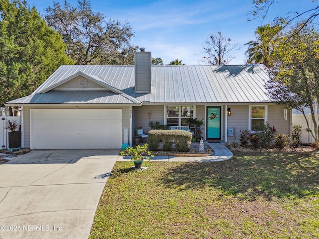 ranch-style house featuring a front yard and a garage