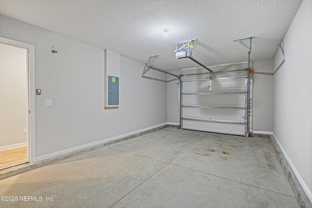 garage featuring a garage door opener and electric panel