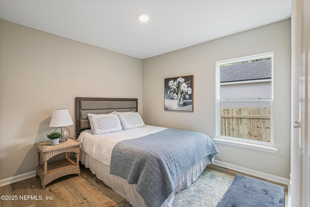 bedroom featuring wood-type flooring