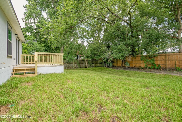 view of yard with a wooden deck