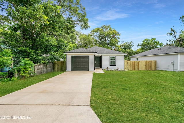 view of front facade featuring a garage and a front lawn