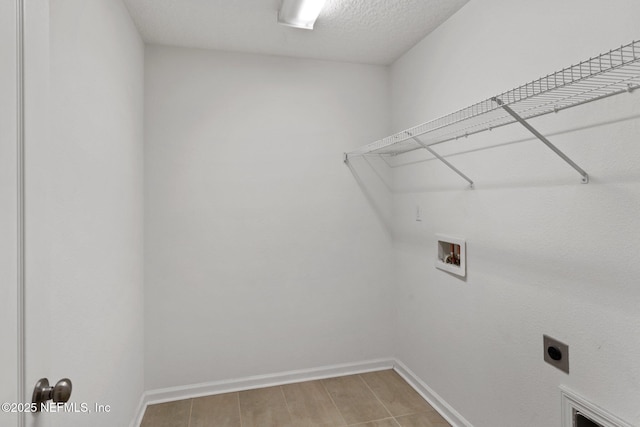 11786 Huckleberry Trl E, Macclenny, FL 32063 - laundry room with hookup for a washing machine, baseboards, and electric dryer hookup