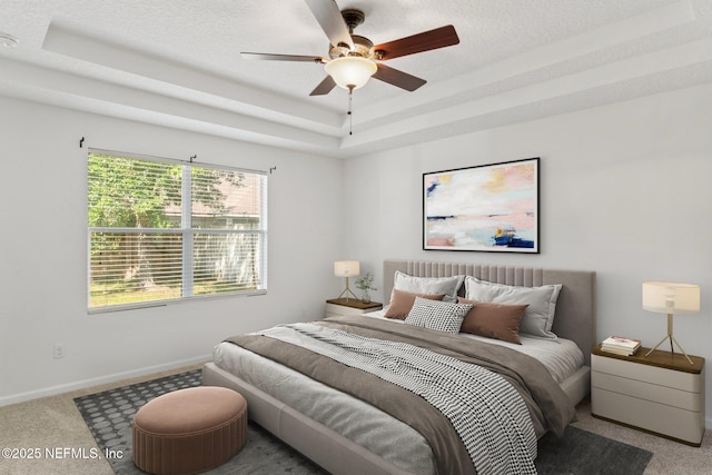 11786 Huckleberry Trl E, Macclenny, FL 32063 - bedroom with carpet flooring, a raised ceiling, baseboards, ceiling fan, and a textured ceiling