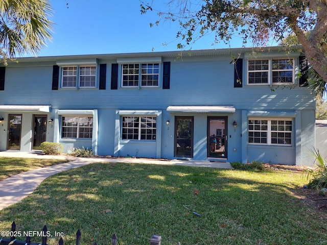 view of front of home with a front lawn