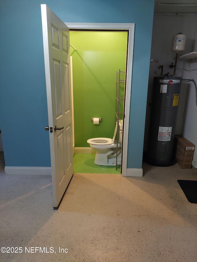 bathroom featuring toilet and electric water heater