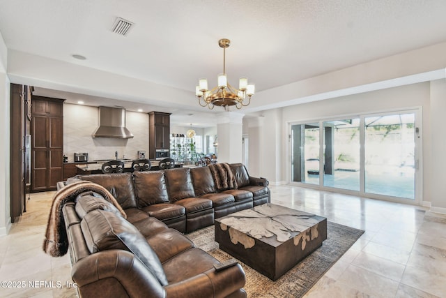 living room featuring a chandelier