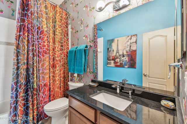 full bathroom with vanity, toilet, and shower / bath combo with shower curtain