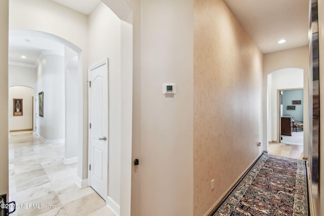 hallway featuring ornamental molding