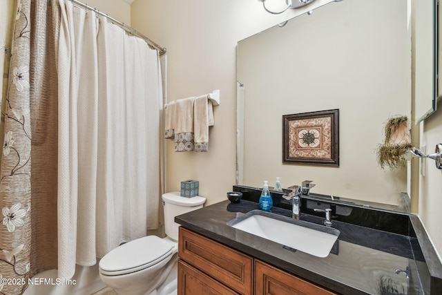 full bathroom featuring vanity, toilet, and shower / tub combo