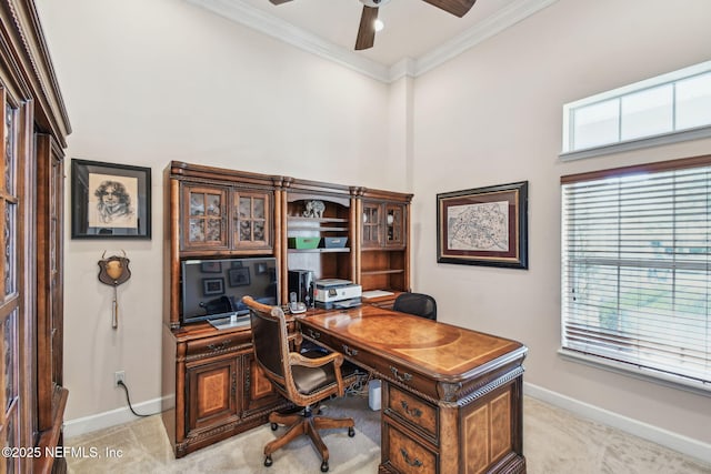 home office featuring light colored carpet, plenty of natural light, crown molding, and ceiling fan