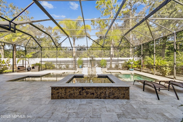 view of patio featuring a lanai and a fenced in pool