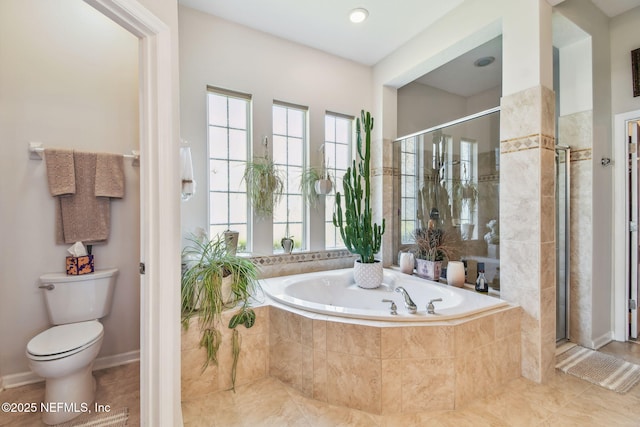 bathroom featuring tile patterned flooring, independent shower and bath, and toilet