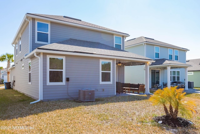 rear view of house featuring cooling unit, a yard, an outdoor hangout area, and a patio area