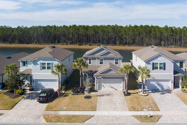 view of front of home with a water view