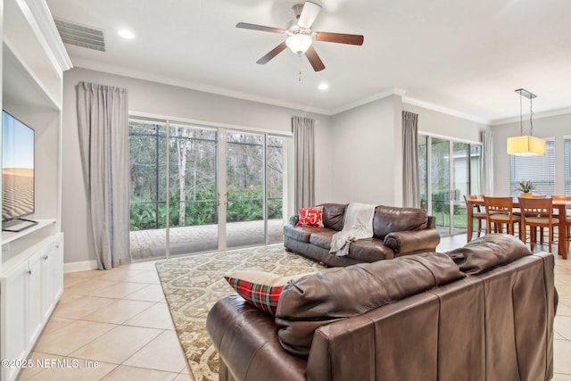 tiled living room featuring ceiling fan and crown molding