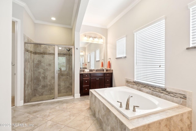 bathroom featuring vanity, tile patterned flooring, ornamental molding, and shower with separate bathtub