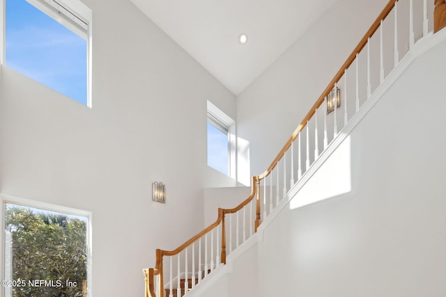 stairs with lofted ceiling