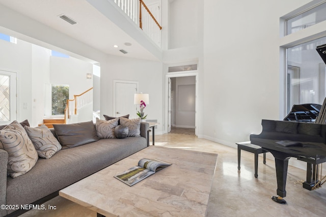 living room featuring a high ceiling