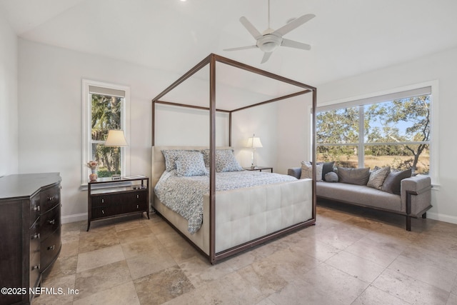 bedroom featuring ceiling fan and multiple windows