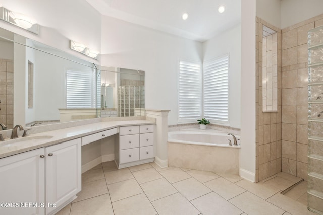 bathroom featuring independent shower and bath, tile patterned floors, and vanity