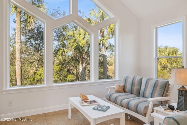 sunroom / solarium with a wealth of natural light and lofted ceiling